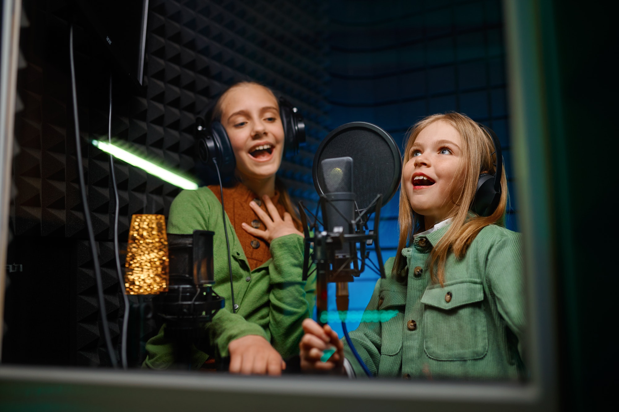 Kids singing in record studio